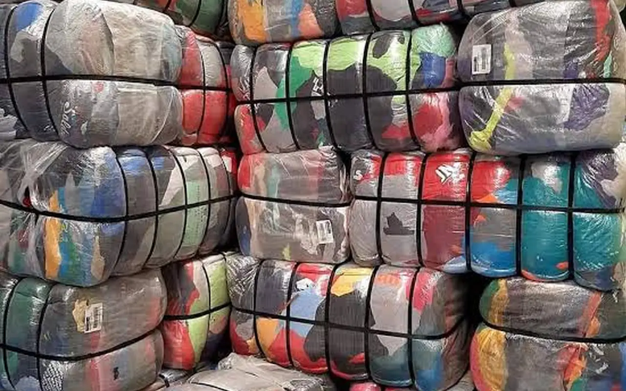 Compressed clothing bales wrapped in plastic