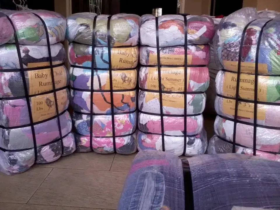 Wrapped bales labelled for children's clothes