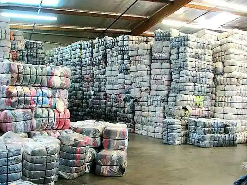 Warehouse stacks of wrapped clothing bales